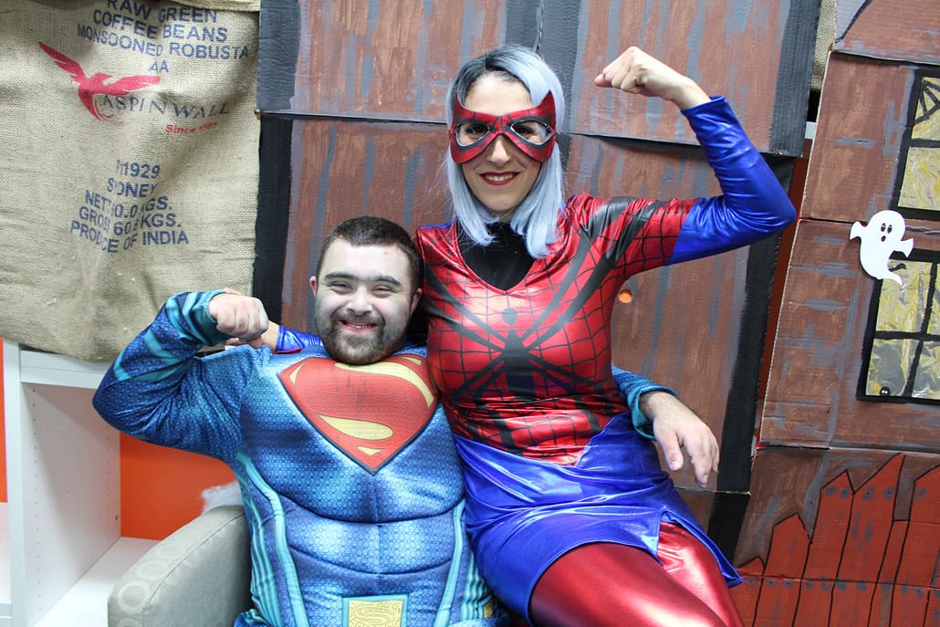Couple wearing superman and spider woman outfit